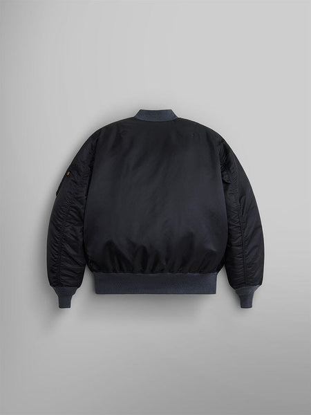 Back view of the 1960s MA-1 Bomber Jacket in black by Alpha Industries, featuring ribbed collar, cuffs, and hem.