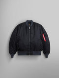 The 1960s MA-1 Bomber Jacket by Alpha Industries in black features a zip-up front, ribbed cuffs, and a signature red tag on the left sleeve.