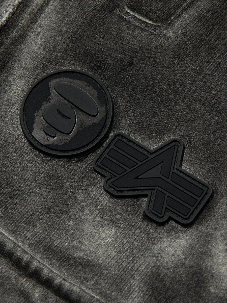 Aape X Alpha Army Sweatpant by Alpha Industries, gray fabric with two black rubber patches, one featuring a stylized ape face and the other a geometric A.