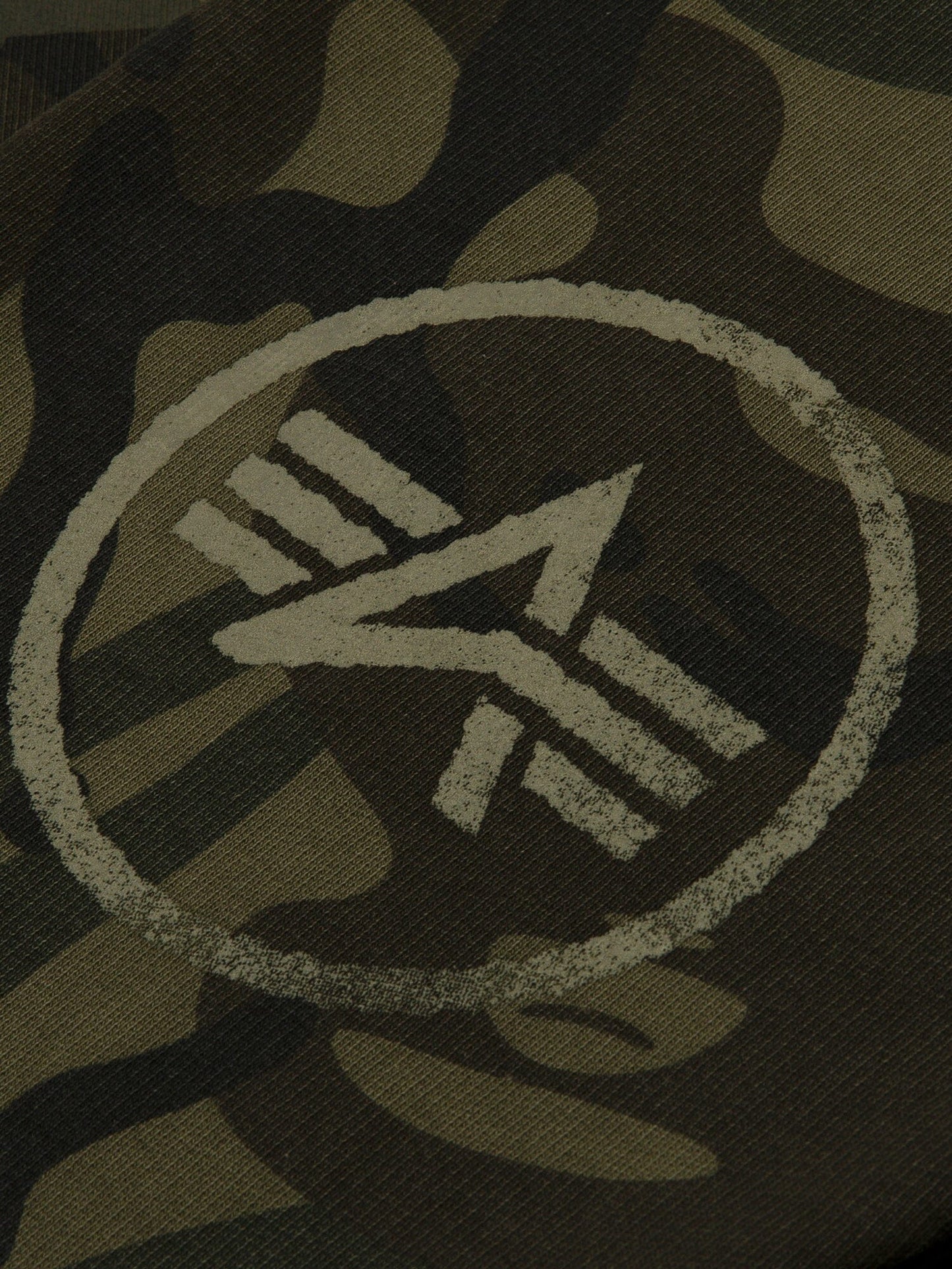 Aape X Alpha Camo Crewneck Sweatshirt by Alpha Industries, camouflage fabric, circular emblem with stylized “A” and three parallel lines.