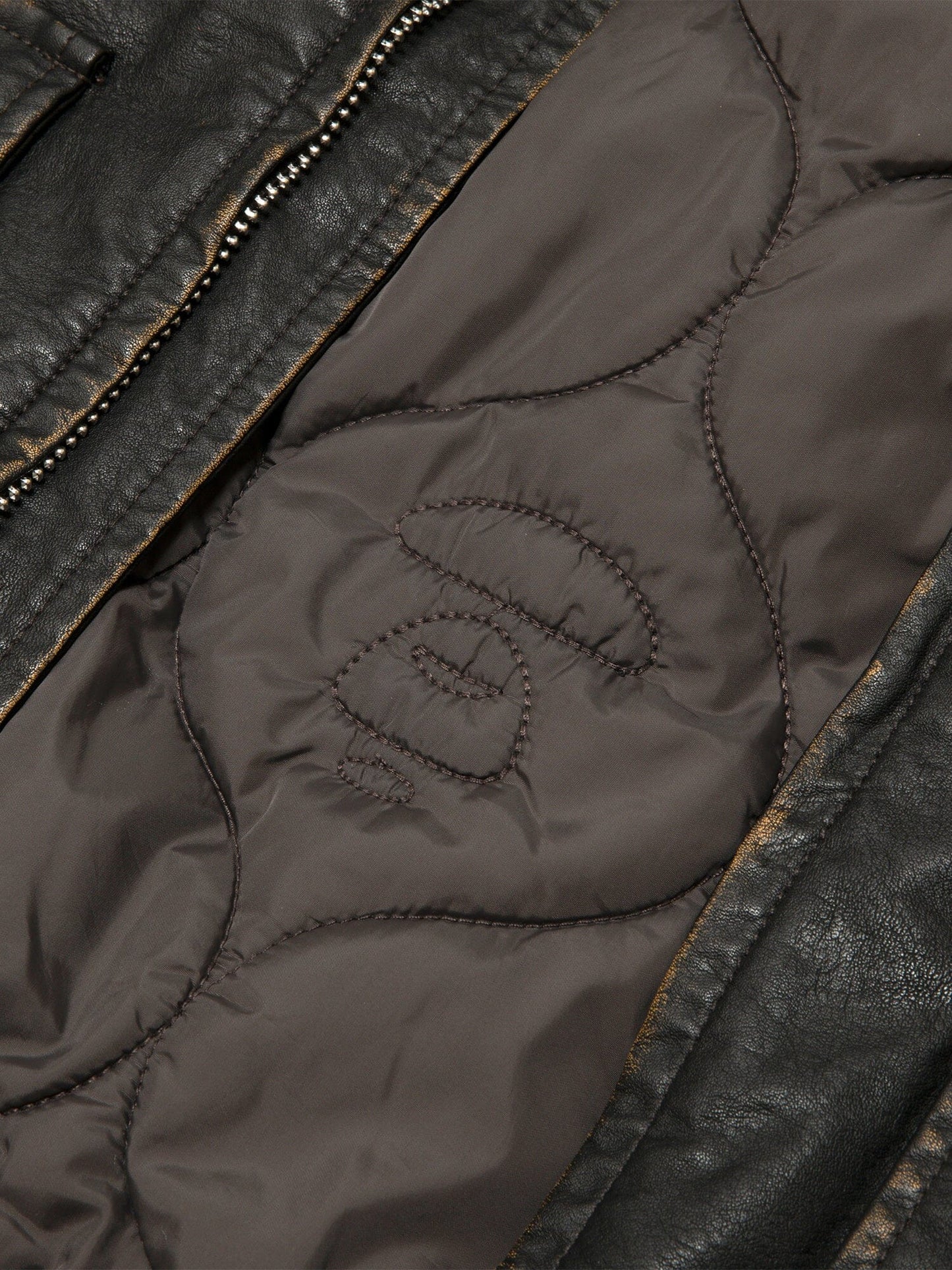 Aape X Alpha Pu Leather Quilted Jacket by Alpha Industries, brown quilted lining, embroidered accents, visible zipper.