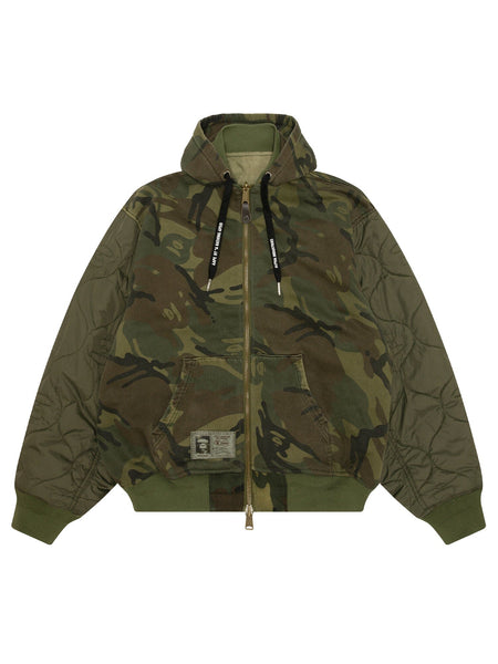 Aape X Alpha Reversible Padded MA-1 Quilted Jacket by Alpha Industries, camouflage design, front zipper, large pockets, black drawstrings, patch label.