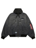 Aape X Alpha Reversible Padded MA-1 Quilted Jacket Black by Alpha Industries, hood, zip front, flap pockets, decorative sleeve tags, printed text, logo details.