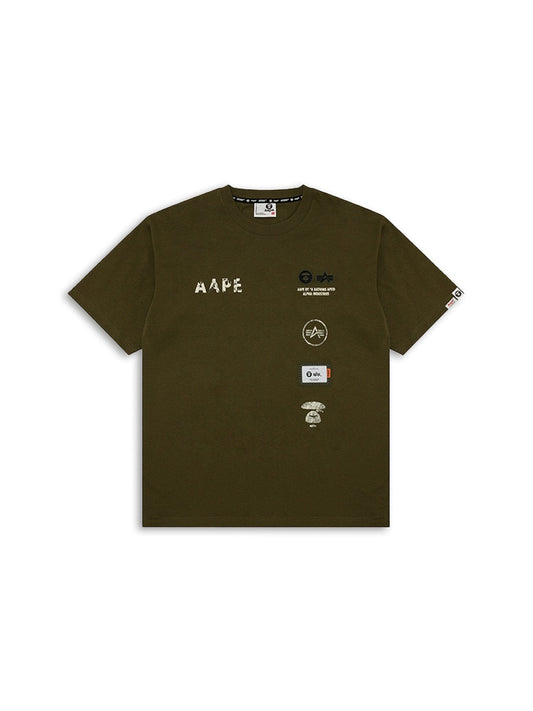 APE X ALPHA Industries Somewhere in Universe Tee in Green with Distressed Feel, Small Logos, and AAPE Text on Front.