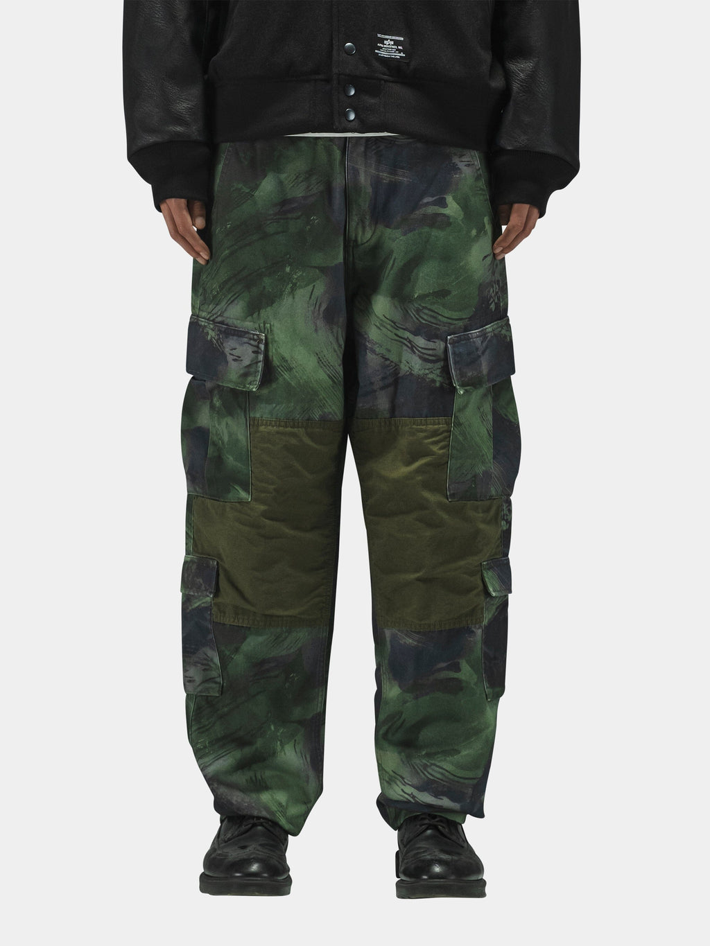 Alpha Industries Acu Pant with utility pockets, black shoes, black jacket.
