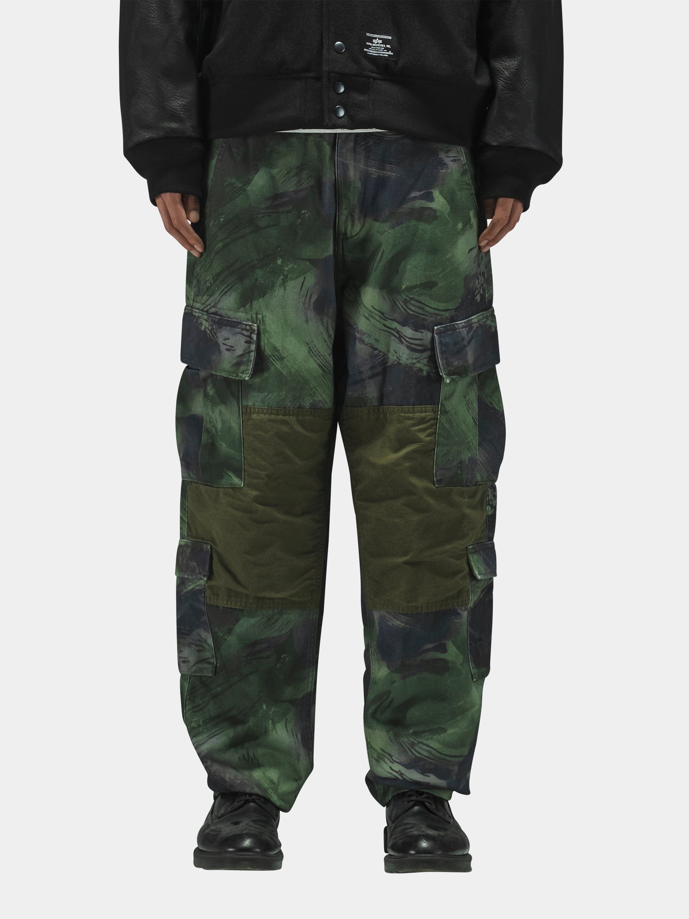 Alpha Industries Acu Pant with utility pockets, black shoes, black jacket.