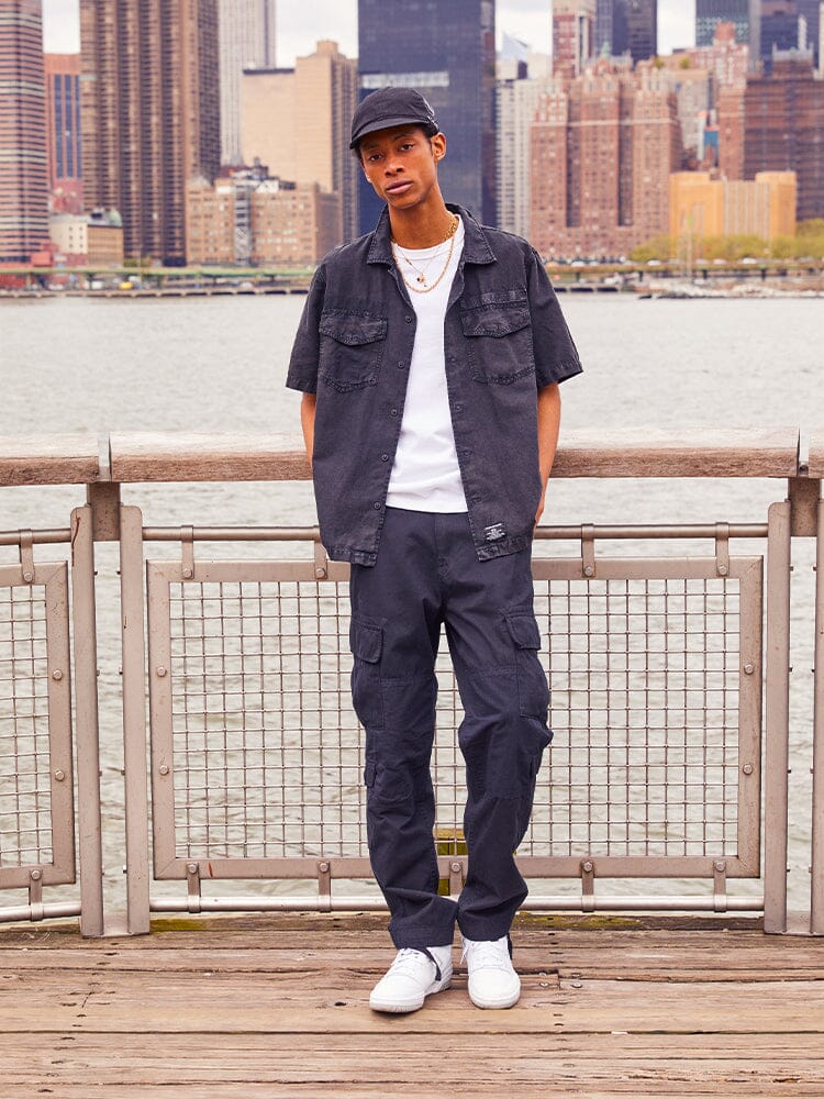 Alpha Industries Acu Pant cargo pants in a dark color with multiple pockets and classic cargo design features.