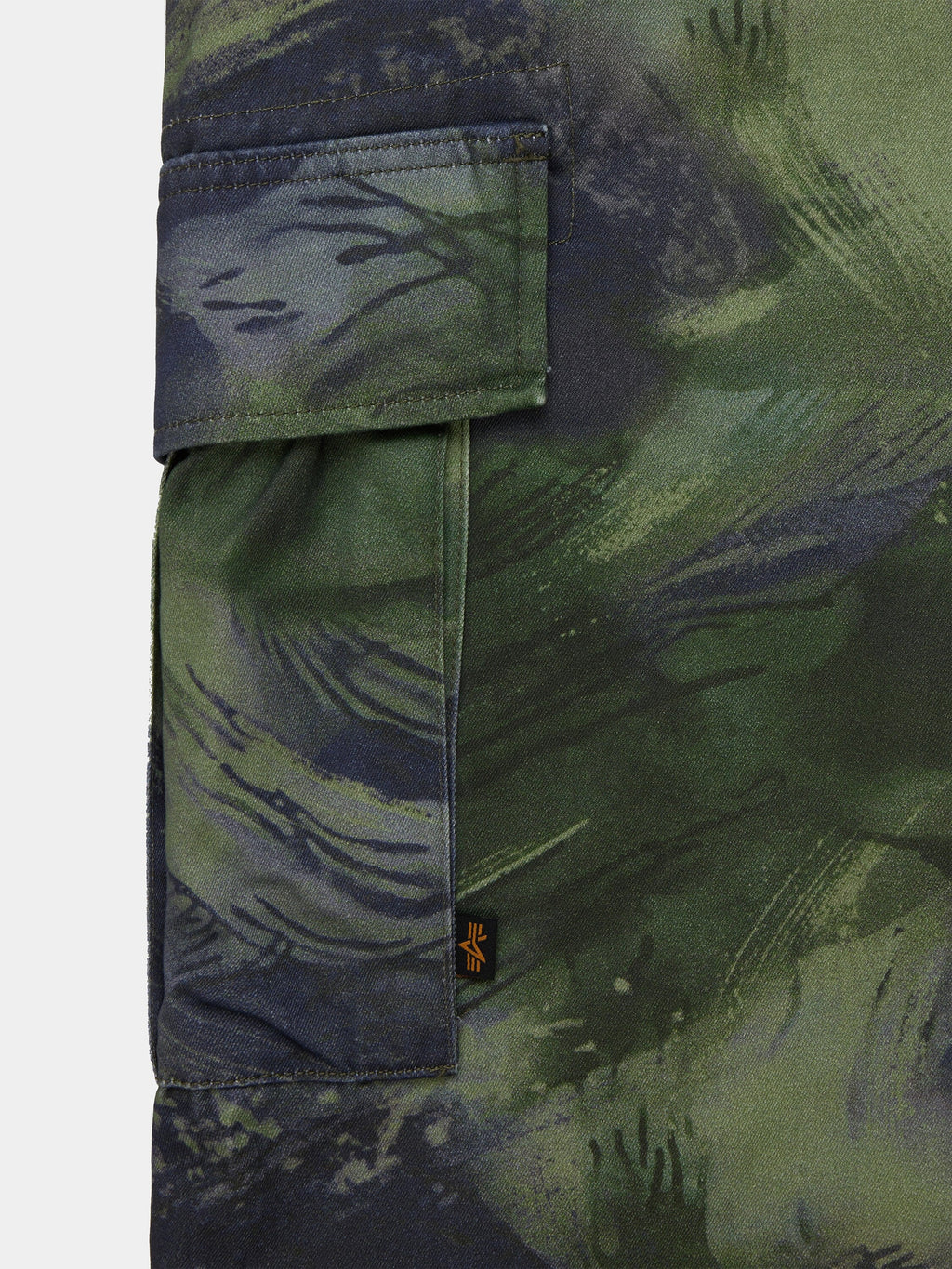 Green and dark blue camouflage Acu Pant by Alpha Industries with flap pocket, utility compartments, and small stitched logo tag.