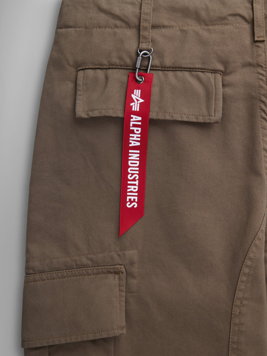 Alpha Industries Acu Pant Coyote Brown, Utility Pockets, Pocket With Red Alpha Industries Tag Attached By Metal Clasp.