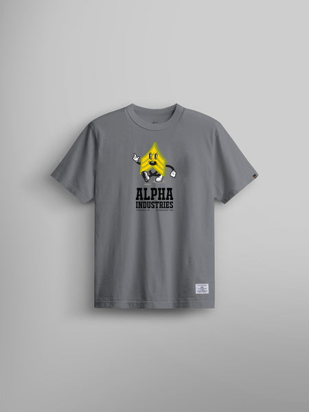 Alpha Badge Tee by Alpha Industries, aircraft gray t-shirt with yellow cartoon character graphic and Alpha Industries text on chest.