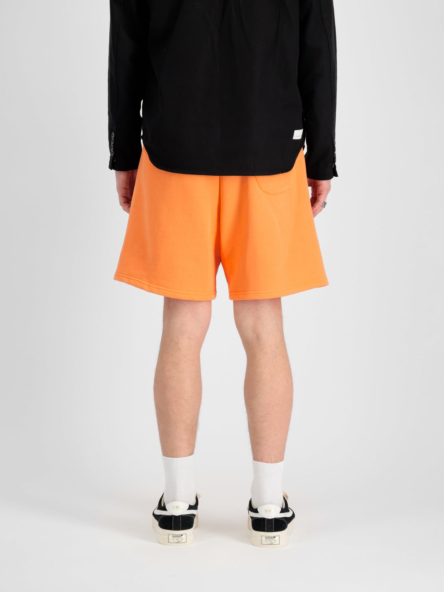 Alpha Essential Relaxed Short by Alpha Industries in bright orange, soft cotton blend, elastic waistband, side pockets.