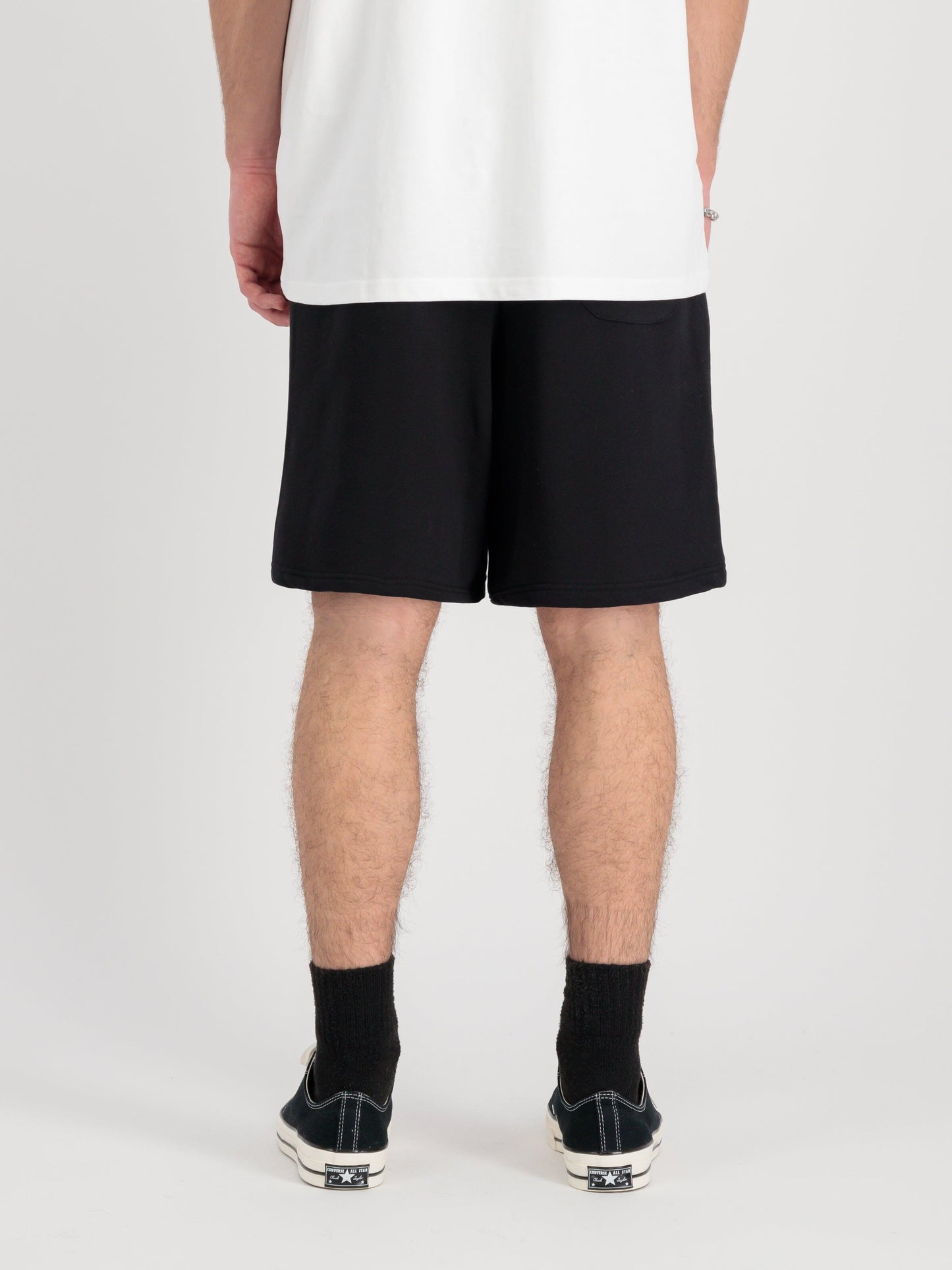 Alpha Industries Alpha Essential Relaxed Short, cotton blend white t-shirt, black socks, black sneakers.