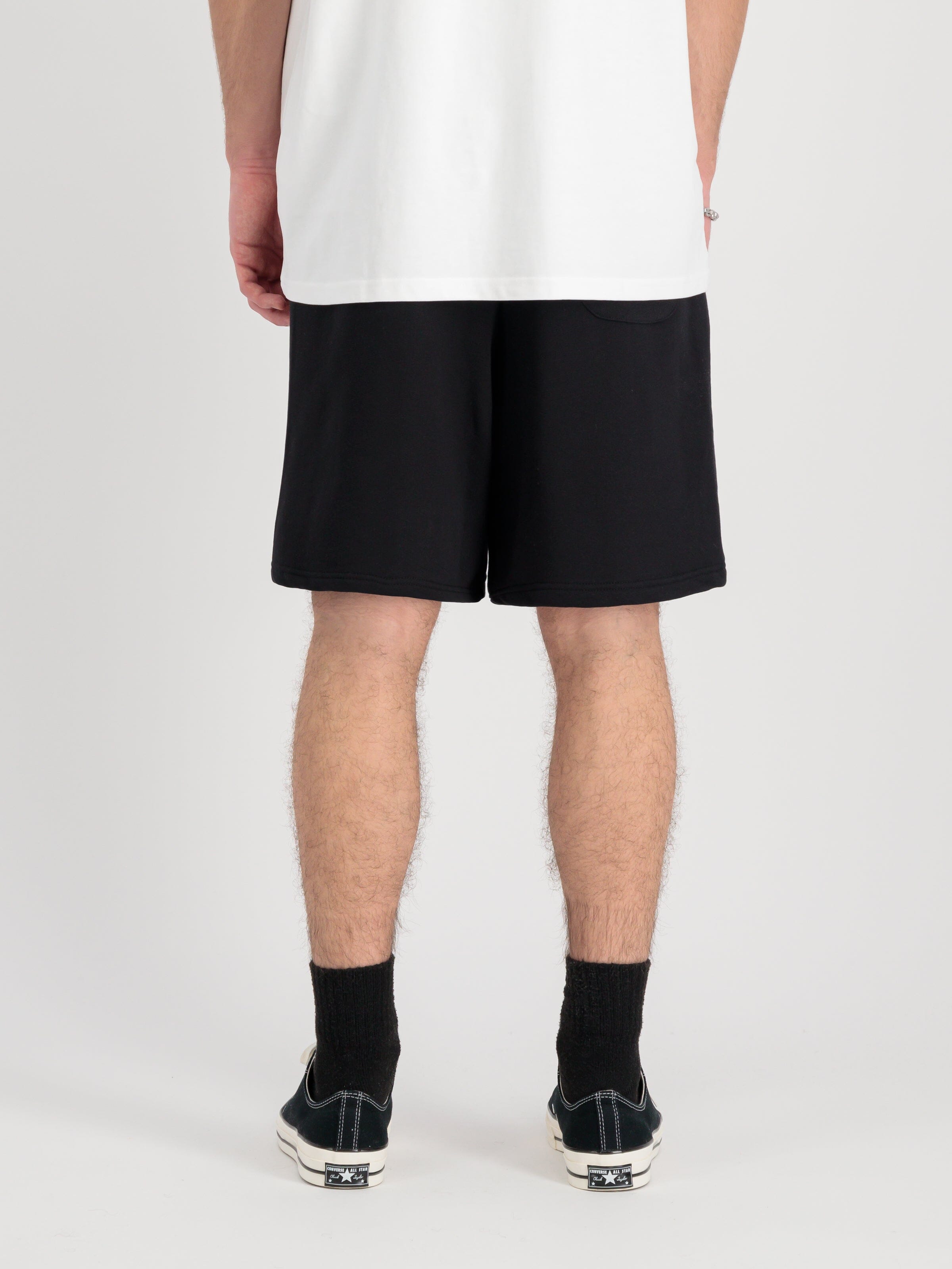 Alpha Industries Alpha Essential Relaxed Short, cotton blend white t-shirt, black socks, black sneakers.