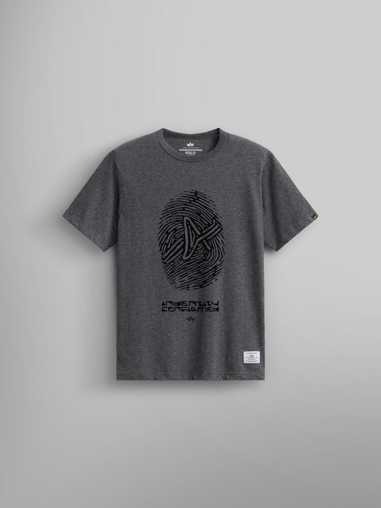 The Alpha Fingerprint Tee in dark charcoal heather is a unisex T-shirt from Alpha Industries featuring an Alpha fingerprint logo in black with a geometric design and the text "Identity Confirmed" on the front.