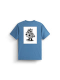 Alpha News Patch Tee by Alpha Industries, elemental blue graphic shirt with black and white back print featuring cartoon spy, hat, trench coat, newspaper, and rolled-up document.
