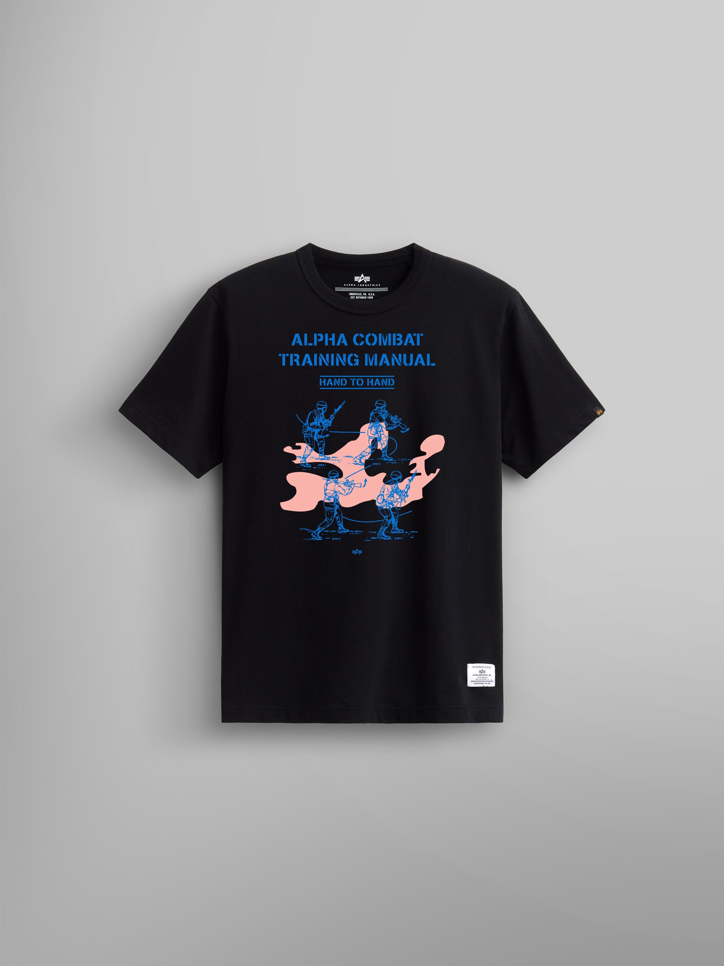 Alpha Training Manual Tee by Alpha Industries, black t-shirt with blue and pink fighter graphics and Alpha Combat Training Manual on the chest.