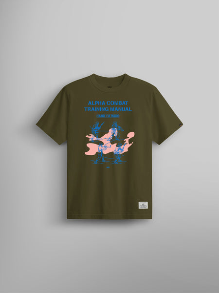 Alpha Training Manual Tee by Alpha Industries in olive with blue MA-1 Combat Training Manual text and blue figures over a pink abstract shape.