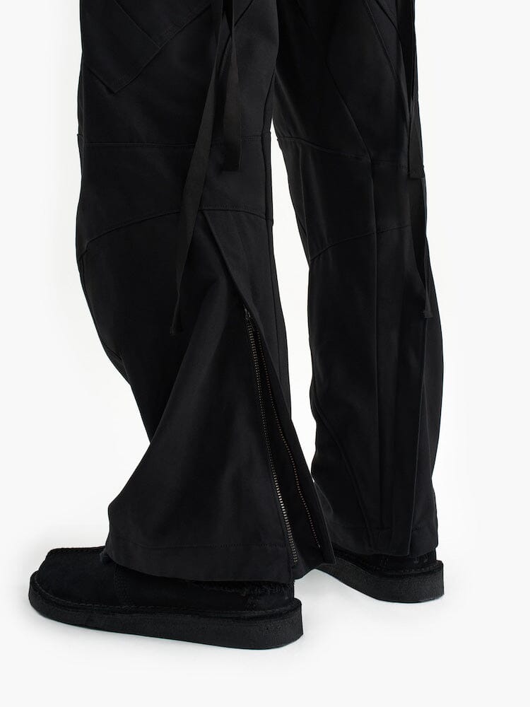 Alpha X Jiyong Kim Curved Multi Pocket Trouser by Alpha Industries, featuring ankle zippers and a curved silhouette.