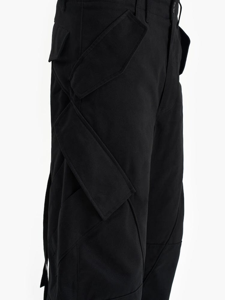 Alpha X Jiyong Kim Curved Multi Pocket Trouser by Alpha Industries, large angular side pockets, flap details, experimental pattern.
