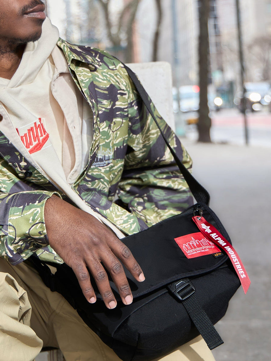 Alpha X Manhattan Portage Nylon Messenger Bag SM Black, Alpha Industries, Camouflage Jacket, Beige Hoodie, Tan Pants.
