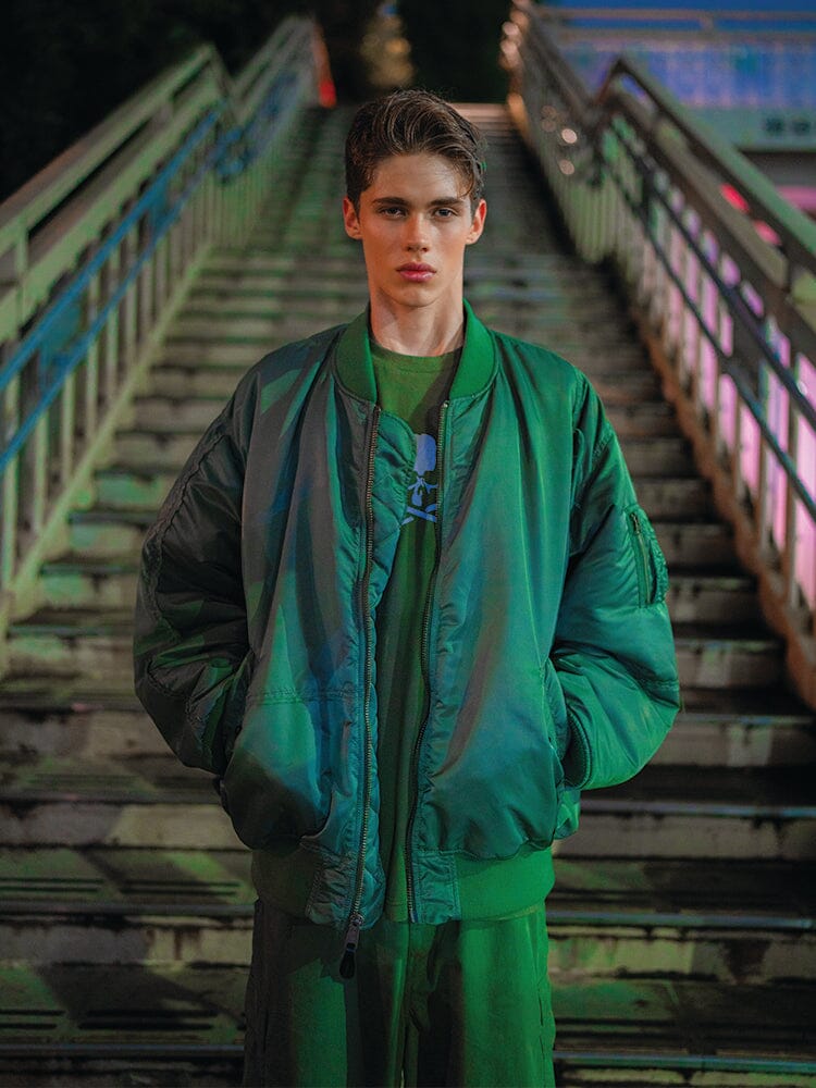 Alpha Industries MA-1 Bomber Jacket, black, with zipper closure and signature sleeve pocket.