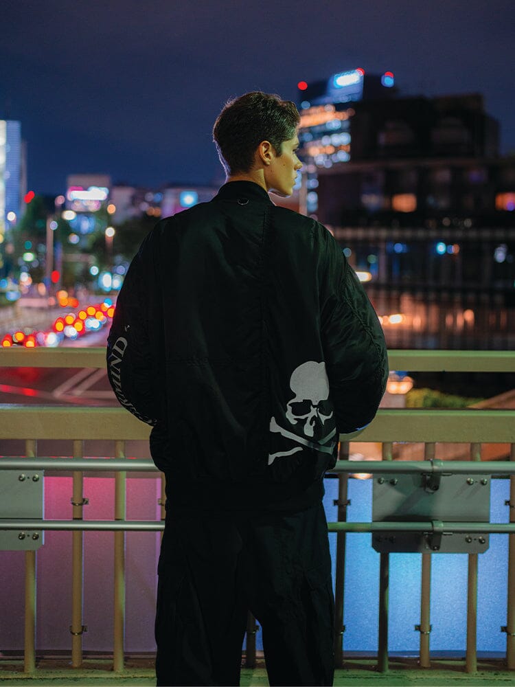 Alpha X Mastermind MA-1 Bomber Jacket by Alpha Industries, black with large white skull graphic.