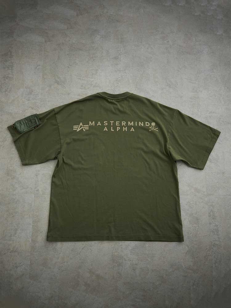 Alpha X Mastermind Tee by Alpha Industries, olive green, back graphics, left sleeve pocket detail, made in Japan.