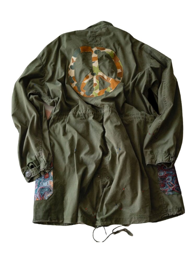 Alpha X Transnomadica Fishtail Parka by Alpha Industries, olive green, camouflage peace symbol on back, upcycled paisley patchwork elbows.