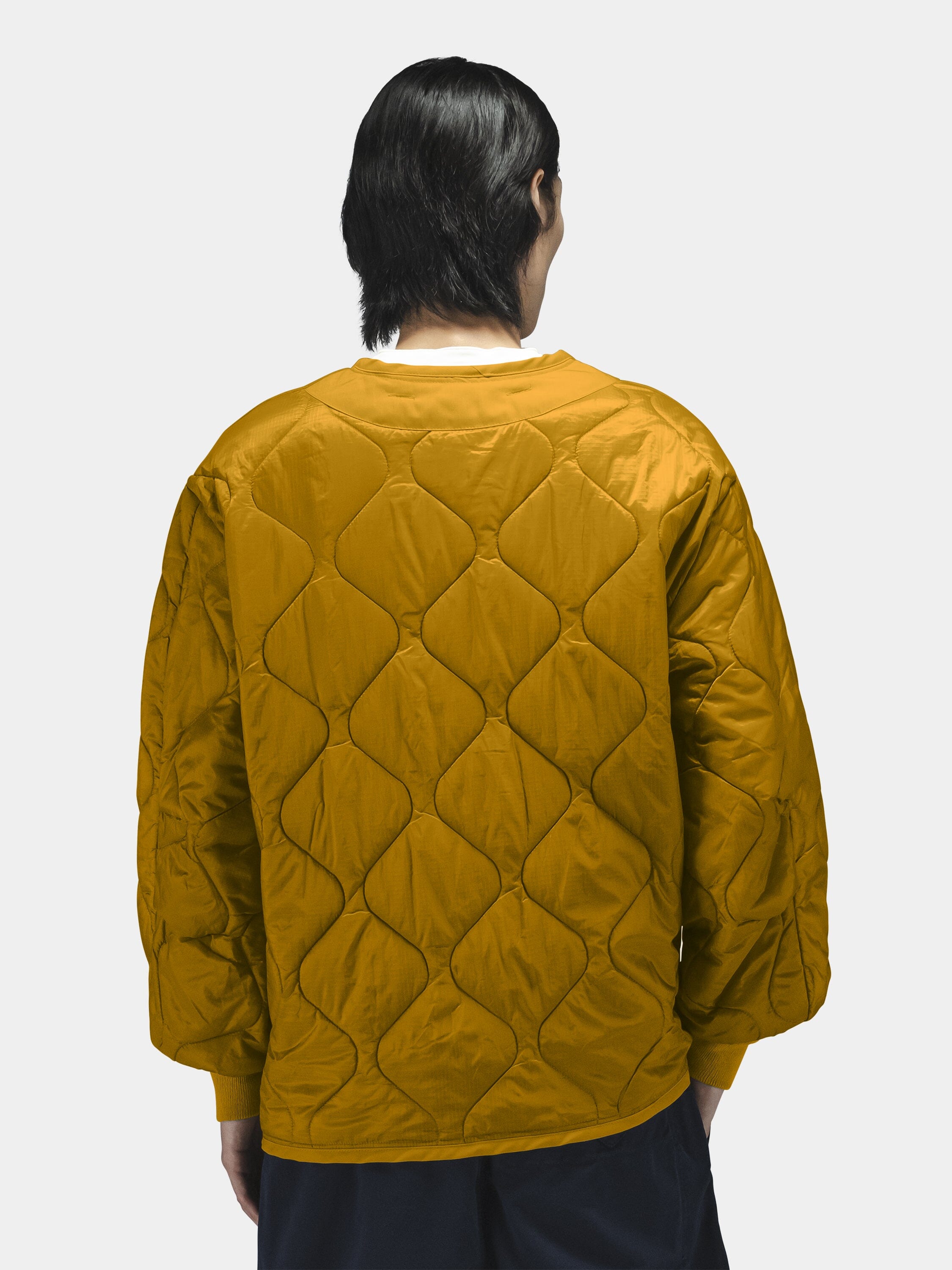 Alpha Industries Als/92 Liner, mustard yellow quilted jacket liner with wavy diamond pattern.