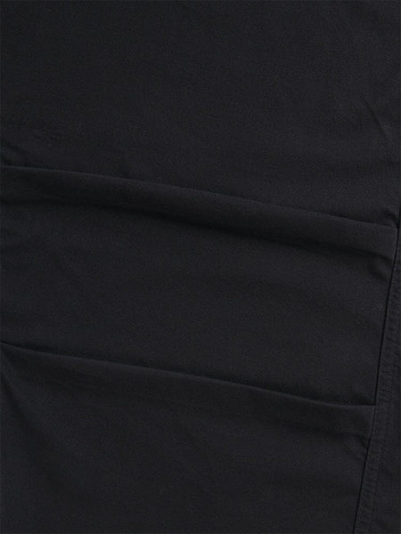 A close-up of the Women's Barrel Leg Pants in black by Alpha Industries highlights the fabric's seams and stitching, radiating the detailed craftsmanship reminiscent of high-waisted pants.