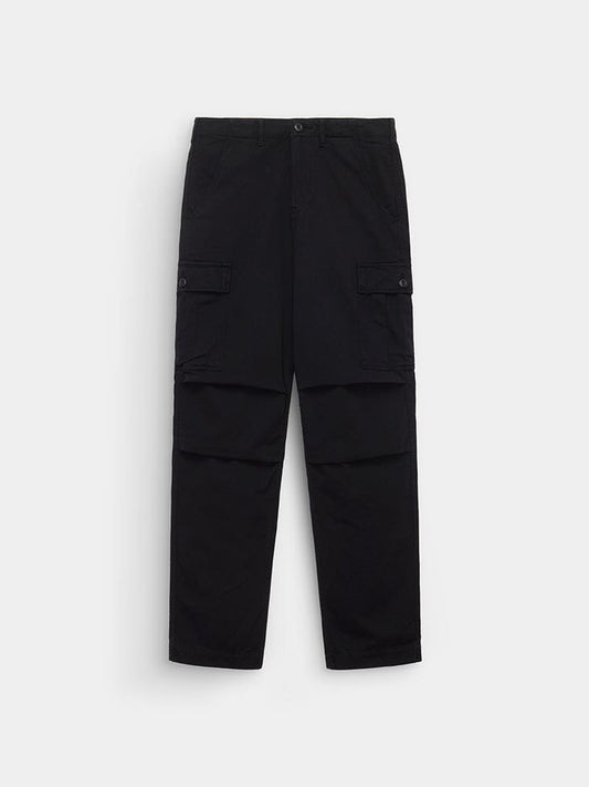 Alpha Industries Bdu Cargo Pant in Black with buttoned flap pockets, straight legs, and a button waist closure.