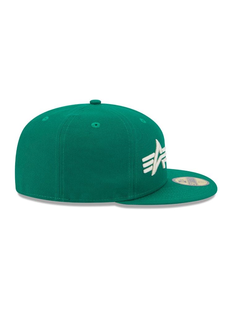 Flat-brimmed green Boston Celtics x Alpha x New Era 59FIFTY Fitted Cap by Alpha Industries, featuring an embroidered team logo on the side and a circular sticker on the brim in classic team colors.