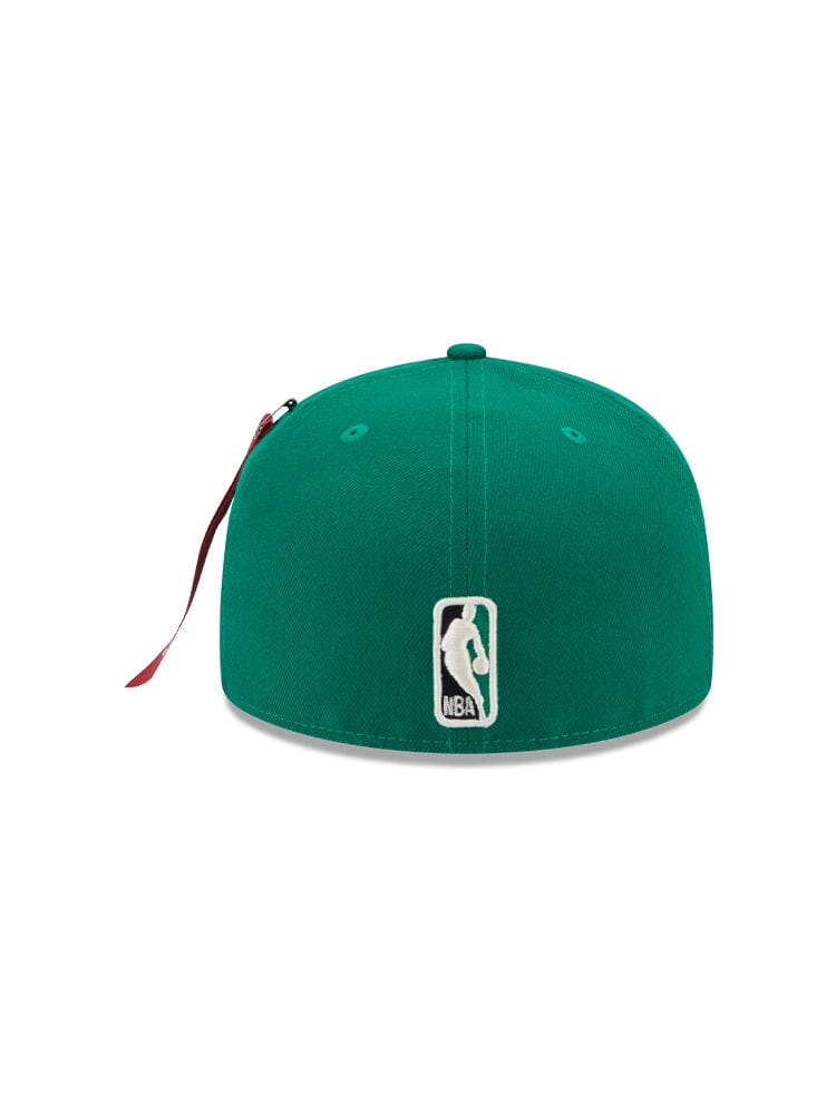 This Boston Celtics x Alpha x New Era 59FIFTY Fitted Cap features a vibrant green design with the iconic NBA logo on the back, complemented by an embroidered team emblem for added style. Crafted by Alpha Industries and NE-NBA, this cap in the classic team color is an essential addition to any fan's collection.