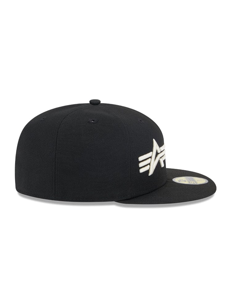 Side view of the Brooklyn Nets x Alpha x New Era 59Fifty fitted cap showing a flat brim and the white embroidered logo of Alpha Industries on the front.
