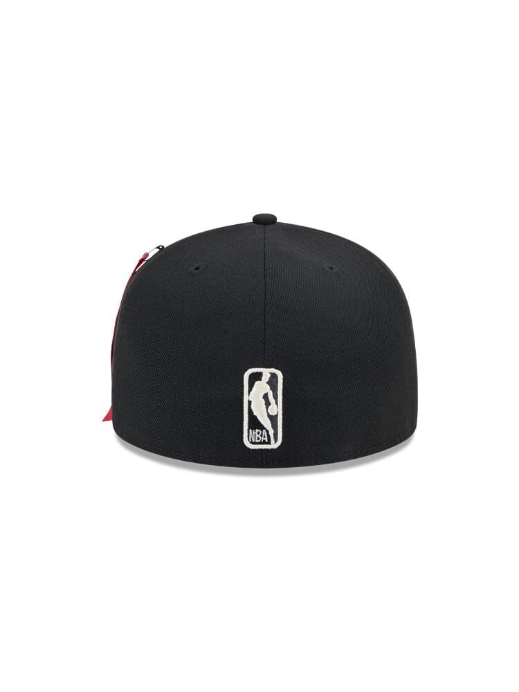 The Brooklyn Nets x Alpha x New Era 59Fifty Fitted Cap from Alpha Industries is shown from the back, highlighting a sleek NBA logo patch.