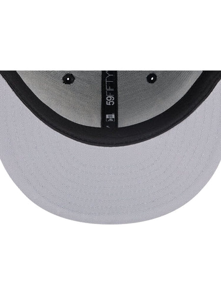 The interior of the Brooklyn Nets x Alpha x New Era 59Fifty Fitted Cap, designed by Alpha Industries / NE-NBA, showcases meticulous stitching and a size label. It embodies the iconic structure characteristic of an Alpha Industries creation, with plenty of room on the exterior for a team logo.