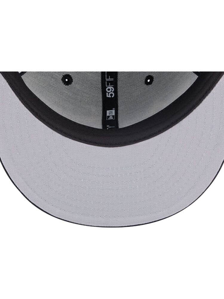 A glimpse inside the Chicago Bulls x Alpha Industries x New Era 59Fifty Fitted Cap reveals its grey design with a black brim, highlighting the team's colors and displaying the iconic 59FIFTY label.