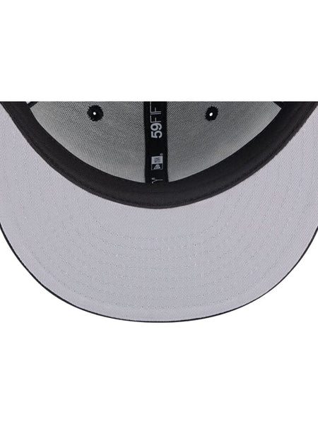 A glimpse inside the Chicago Bulls x Alpha Industries x New Era 59Fifty Fitted Cap reveals its grey design with a black brim, highlighting the team's colors and displaying the iconic 59FIFTY label.