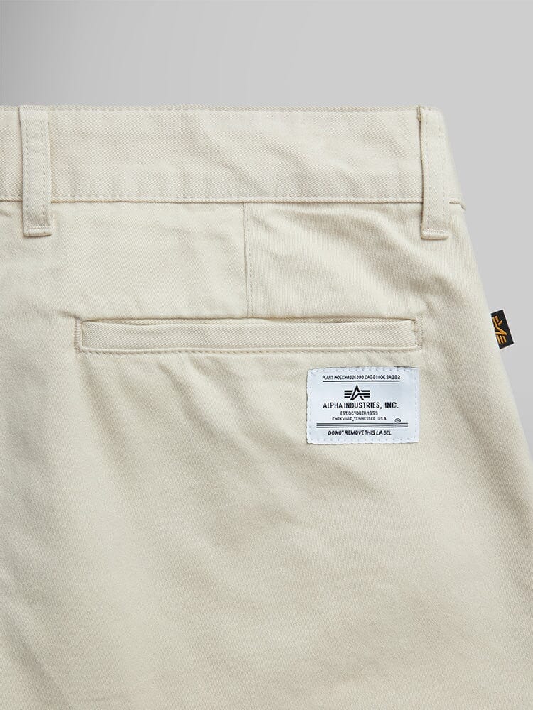 Alpha Industries Classic Trouser in cotton with welt pocket, D-ring detail, and white brand label above the pocket.