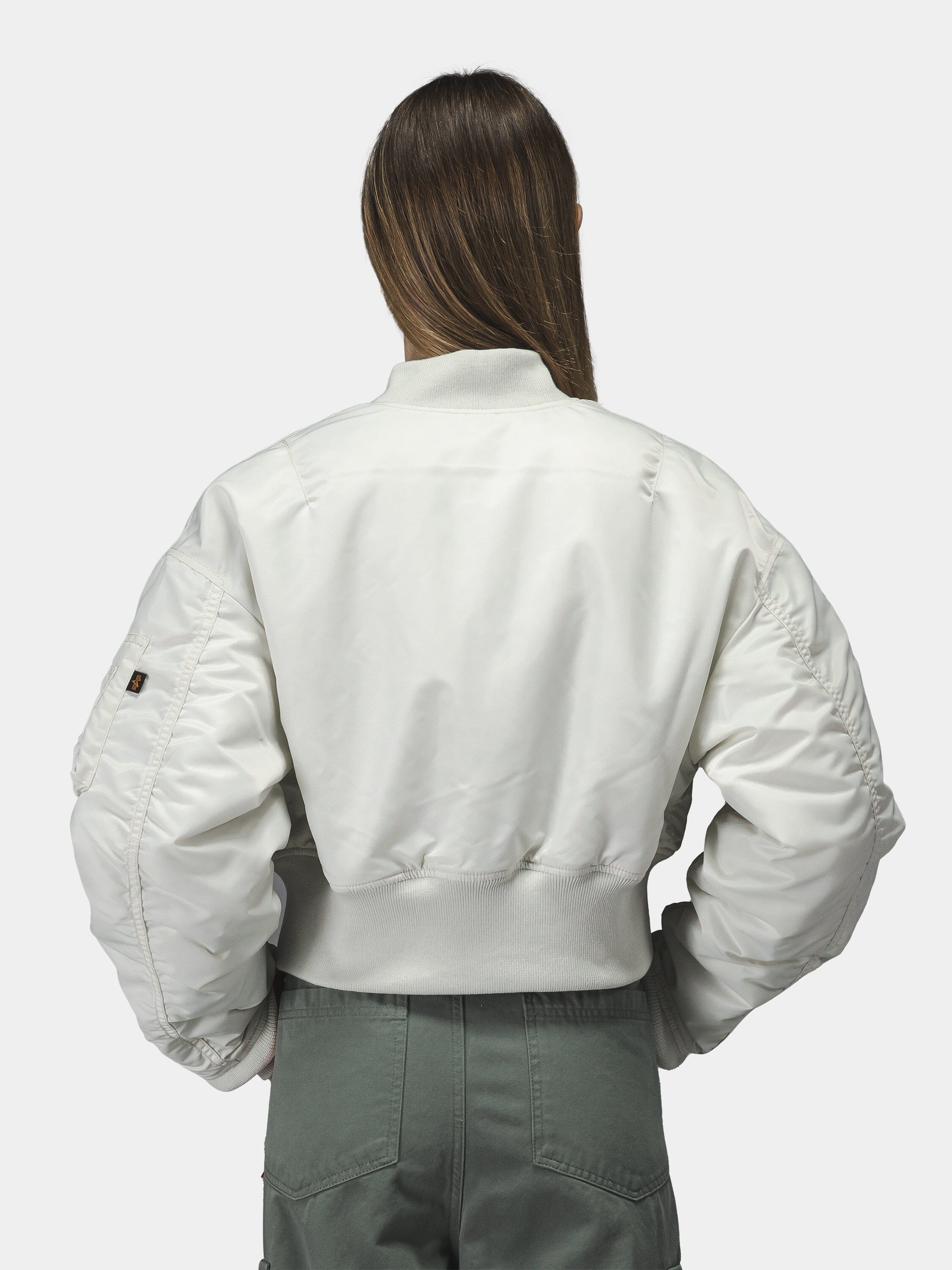 Alpha Industries Cropped MA-1 Flight Jacket Womens in white, featuring cropped length and classic bomber design.
