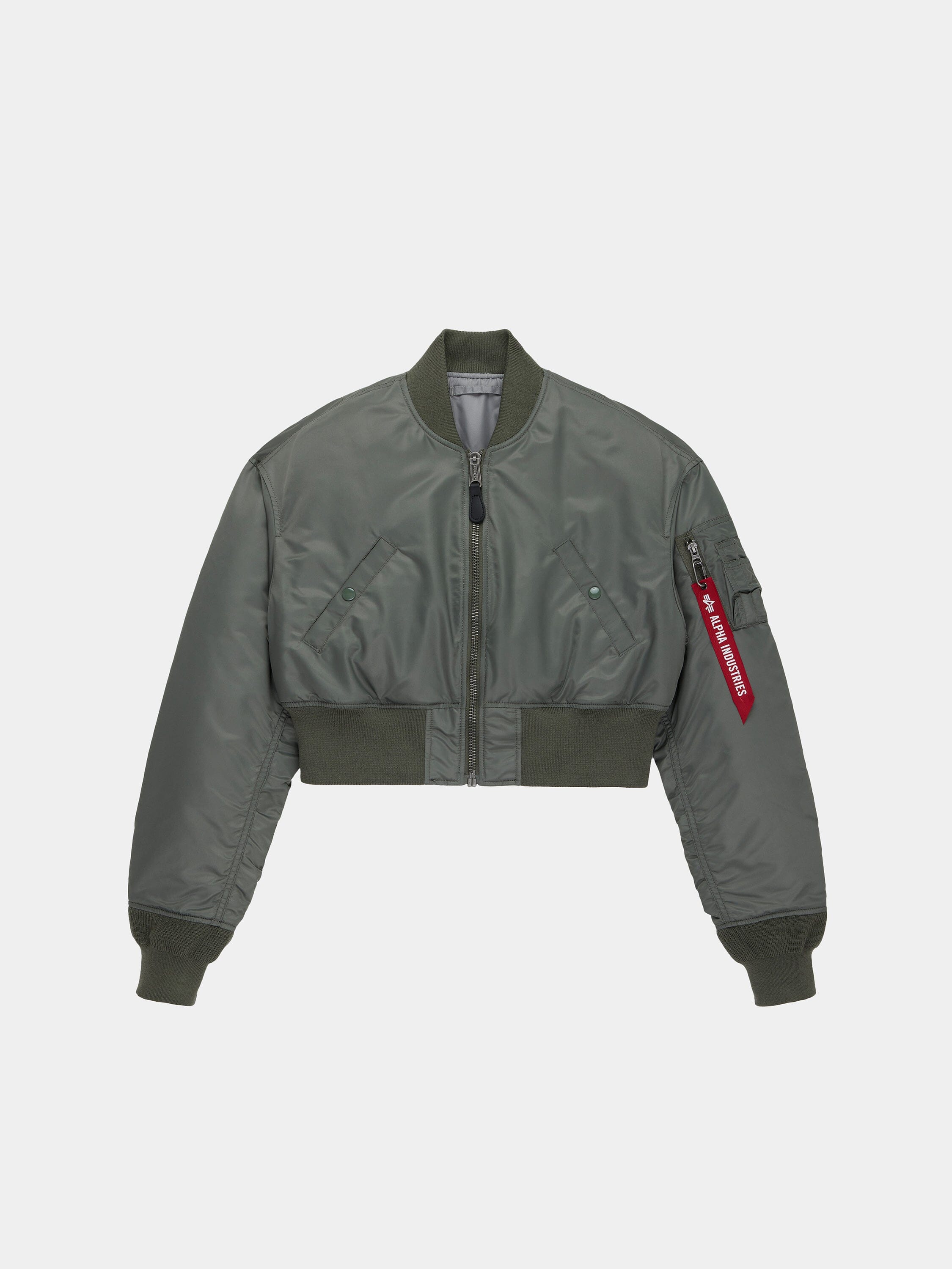 Alpha Industries Cropped MA-1 Flight Jacket in field gray with ribbed cuffs and hem, front zipper, flap pockets, red sleeve tag.