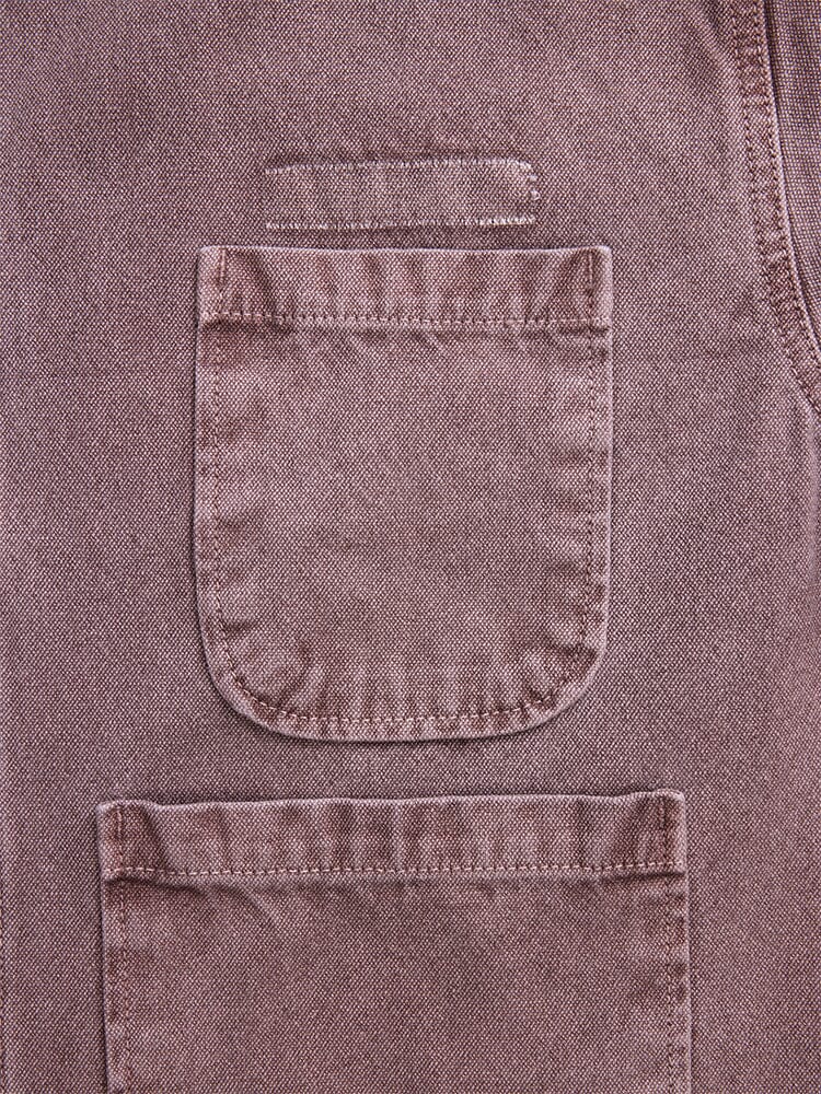 Alpha Industries Womens Canvas Chore Coat, brown canvas with two rectangular pockets and a horizontal loop above the upper pocket.