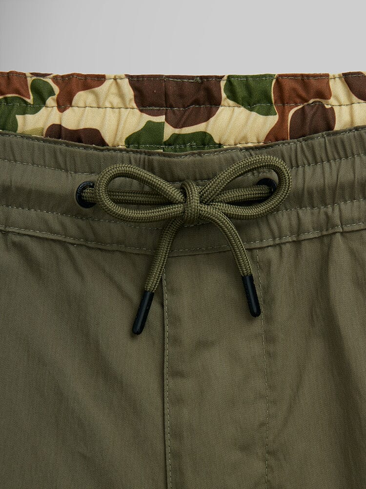 Alpha Industries CWU 36/P Pull On Short, green with beige, brown, and green camouflage inner waistband and elastic waist.