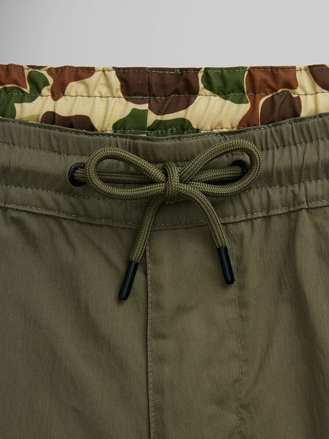 Alpha Industries CWU 36/P Pull On Short, green with beige, brown, and green camouflage inner waistband and elastic waist.