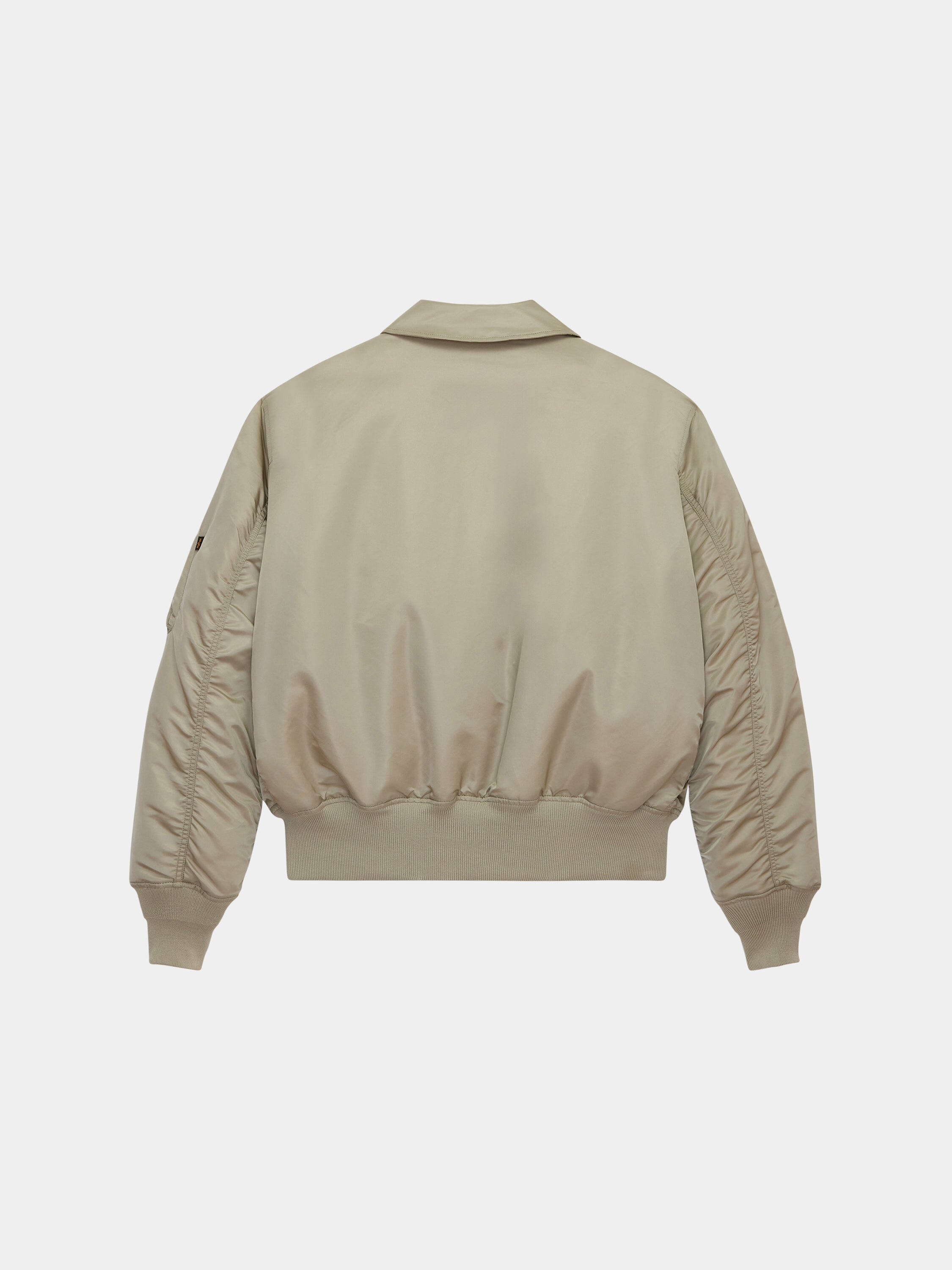 Cwu 45/P Bomber Jacket by Alpha Industries in beige with ribbed cuffs, fitted waistband, and smooth water-resistant finish.