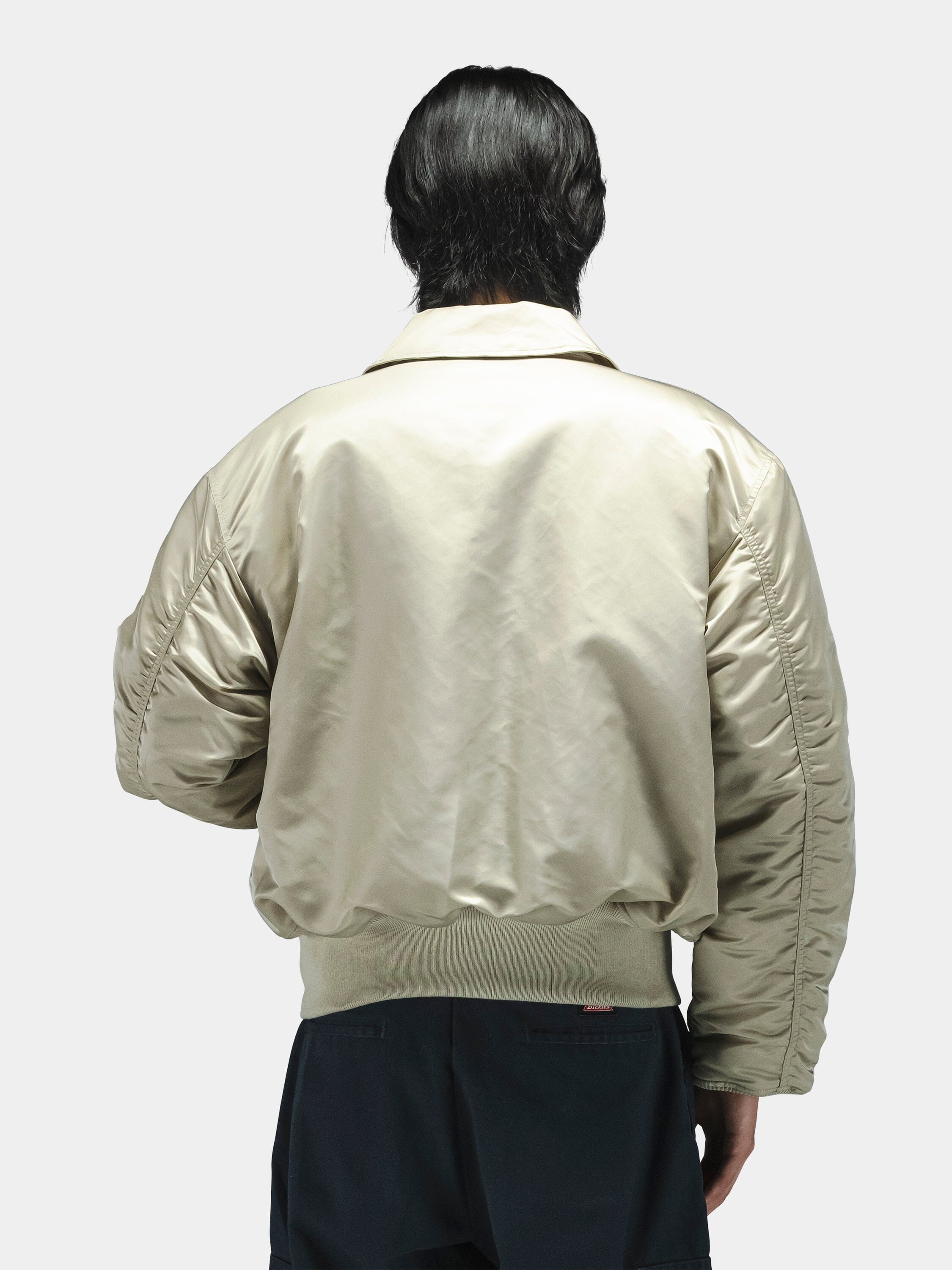 Alpha Industries Cwu 45/P Bomber Jacket in light color with shiny finish and classic design details.