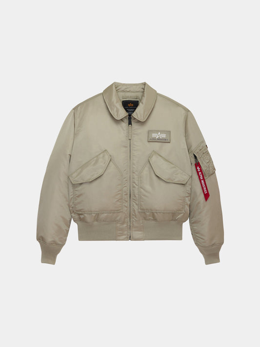 Alpha Industries Cwu 45/P Bomber Jacket in Mineral with front zipper, two flap pockets, chest patch, and red tag on sleeve pocket.