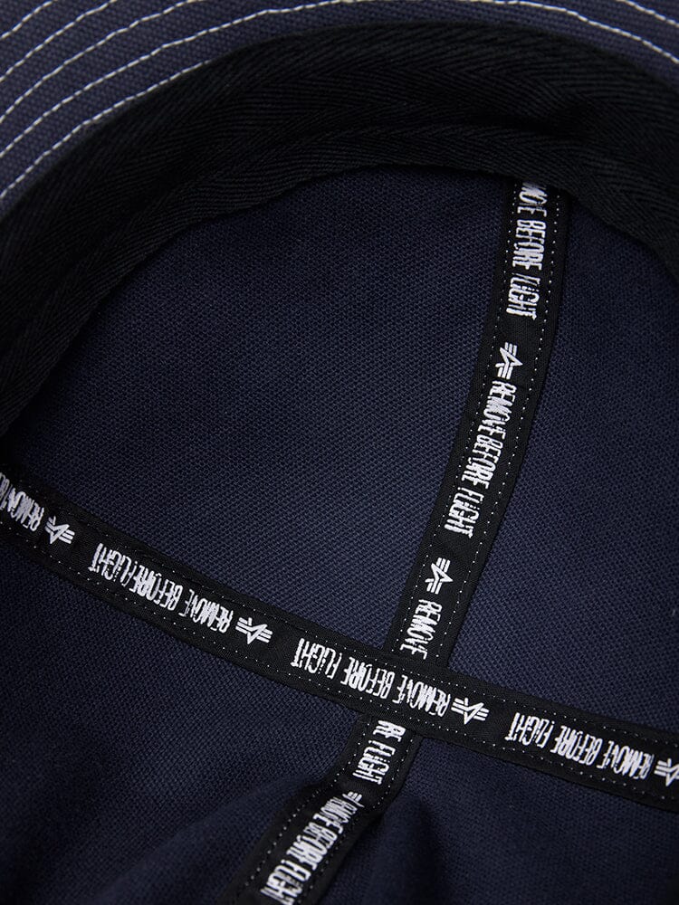 Canvas Daisy Mae MA-1 Bucket Hat by Alpha Industries in navy canvas with black cross-stitched bands and white stitched brim.