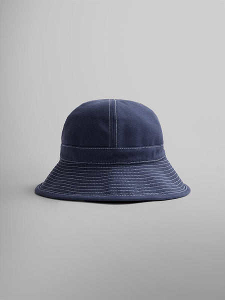 Alpha Industries Canvas Daisy Mae MA-1 Bucket Hat, navy blue canvas with white stitching.