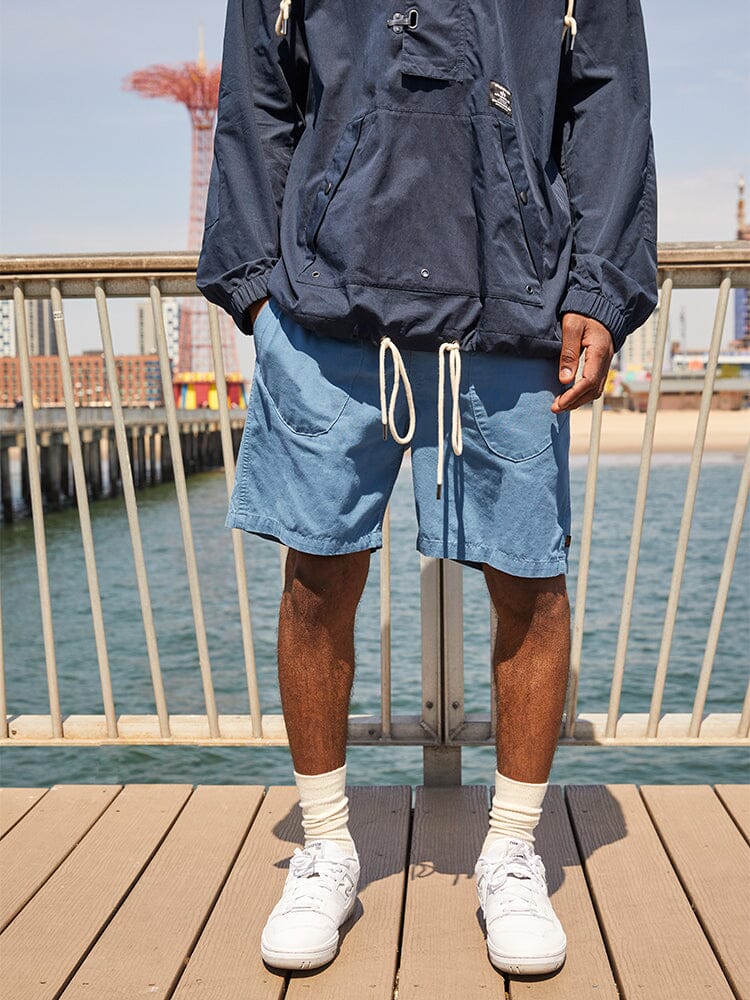 Alpha Industries Deck Shorts and Navy Jacket, featuring zip and button closures.